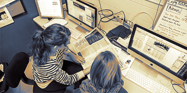 Students work in The Mirror office
