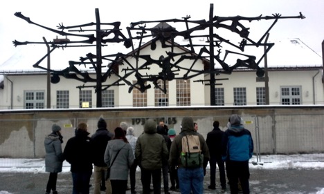 The group takes in the haunting history at Dachau.